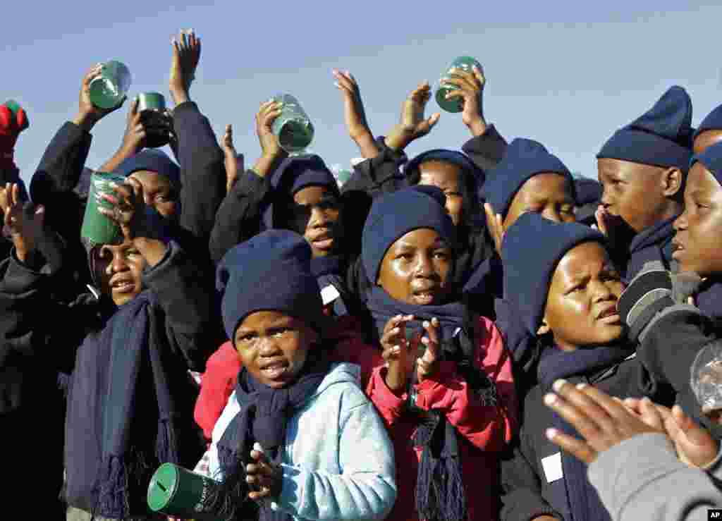 Children sing happy birthday in honor of former South African president Nelson Mandela during celebrations for Mandela&#39;s birthday in Mvezo, South Africa, July 18, 2012.