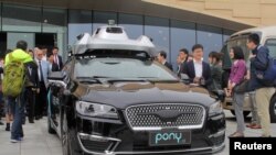 Беспилотный автомобиль компании Pony.ai, во время организованного китайским правительством тура по району Большого залива Гуандун-Гонконг-Макао в Гуанчжоу, Китай, 28 февраля 2019 г.