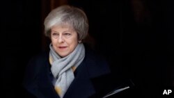 FILE - Britain's Prime Minister Theresa May leaves a cabinet meeting at Downing Street in London, Jan. 15, 2019.