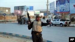 Afghan security forces arrive at the site of an explosion and attack by gunmen, in Kabul, Afghanistan, Monday, Dec. 24, 2018.