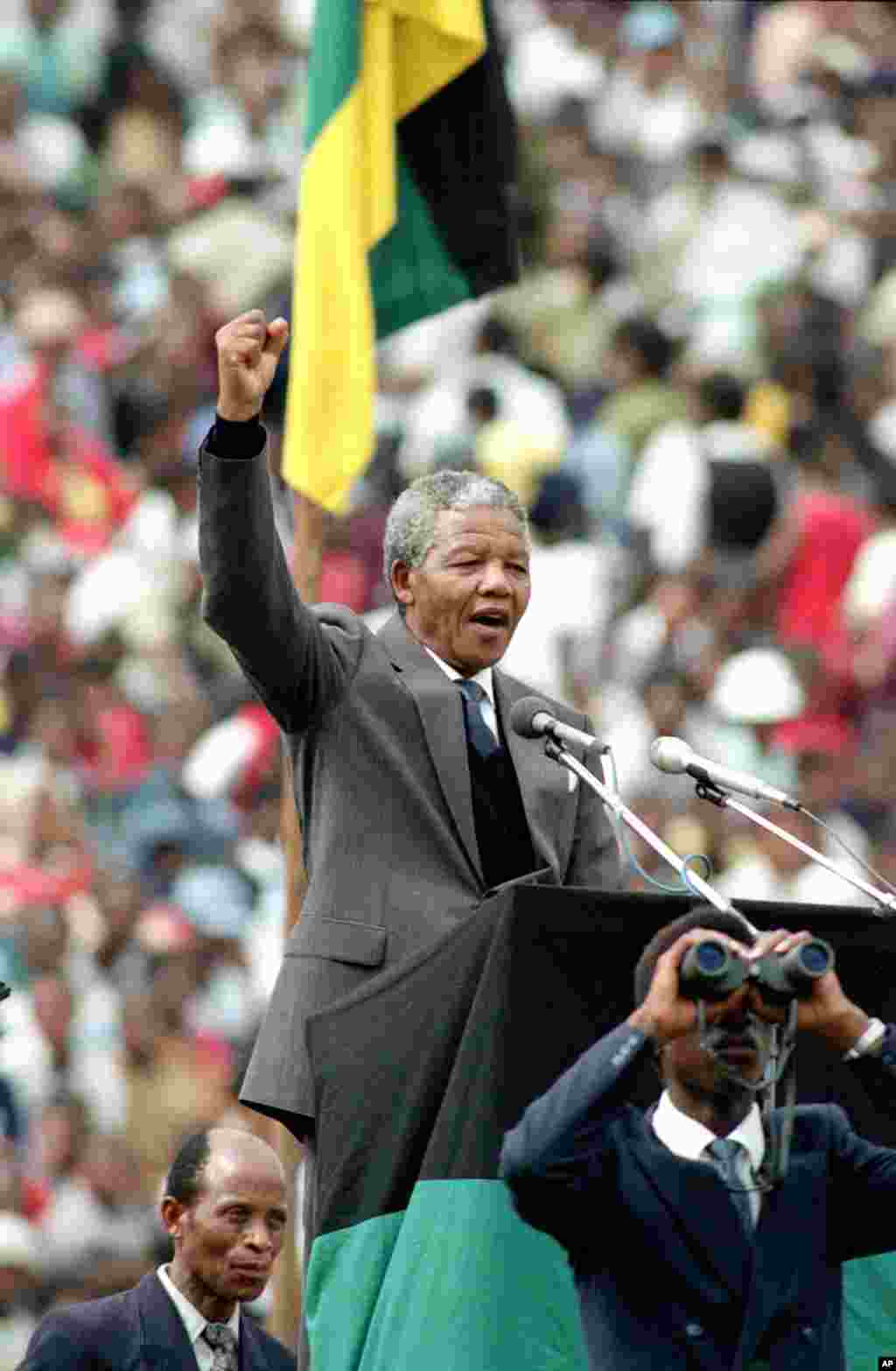 ANC leader and symbol of resistance to apartheid, Nelson Mandela, is seen as he gives the black power salute to the 120,000 ANC supporters in&nbsp; Soweto&#39;s Soccer City stadium in Soweto, near Johannesburg, South Africa, Feb. 13, 1990.